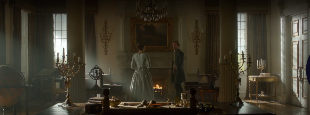 Wide show showing the characters of Elizabeth I and Archduke alone in an otherwise empty room