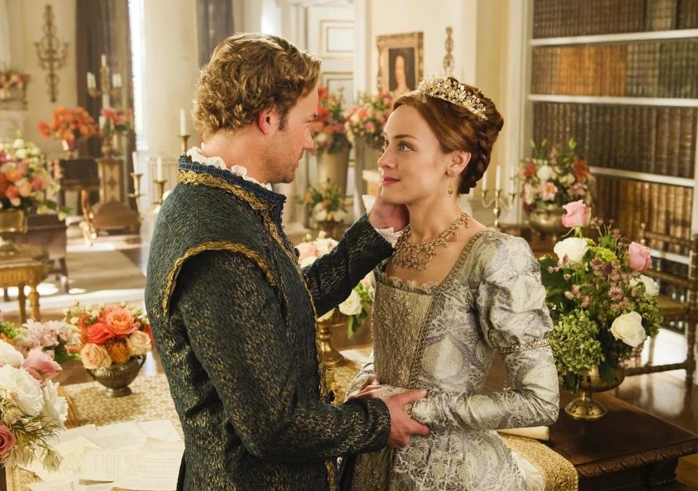 Promotional image from Season 4 of Reign showing Archduke Ferdinand embracing Elizabeth